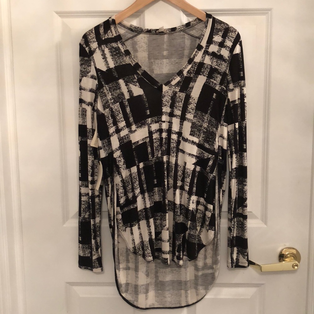 Fall v-neck layering piece with flannel print.